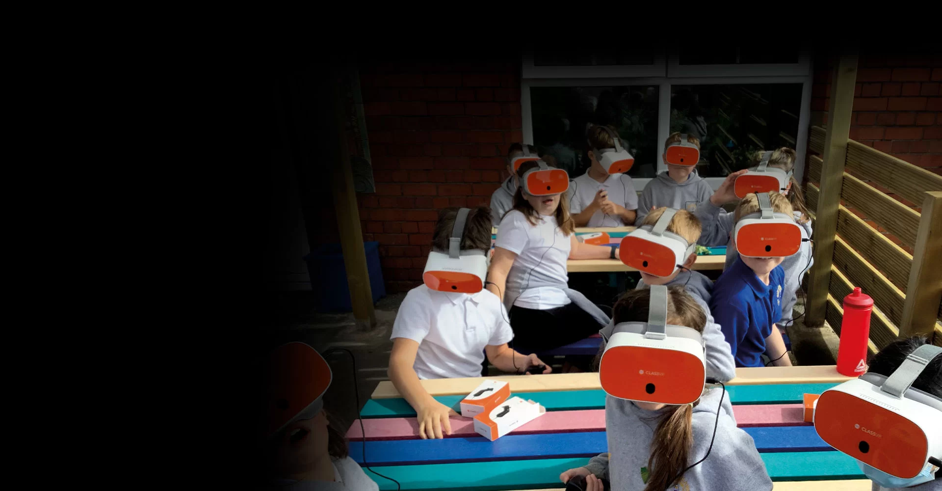 Students outside in school wearing ClassVR headsets